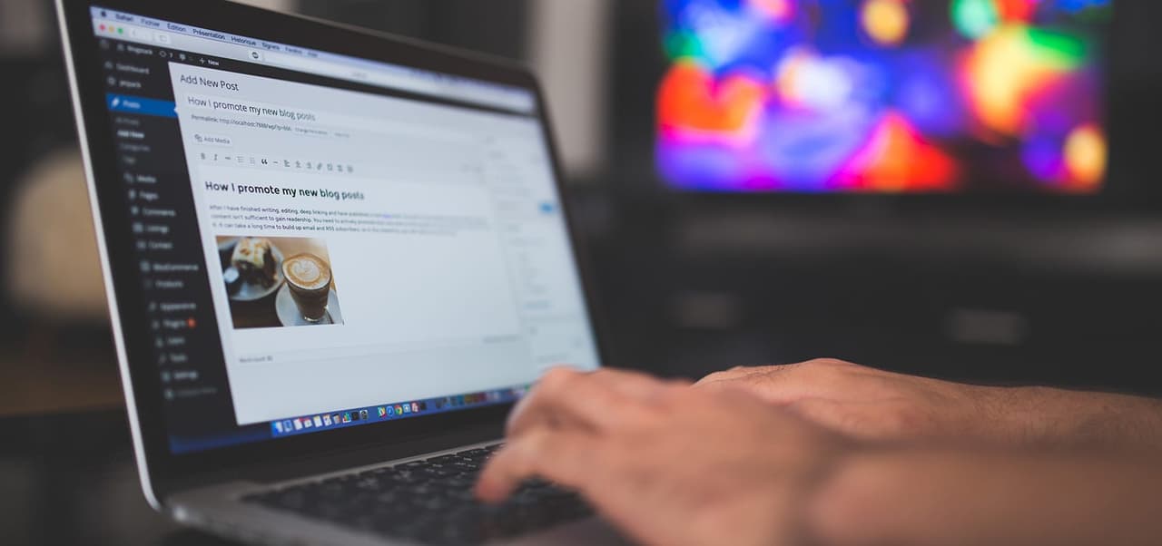 Writing a blog post on a laptop